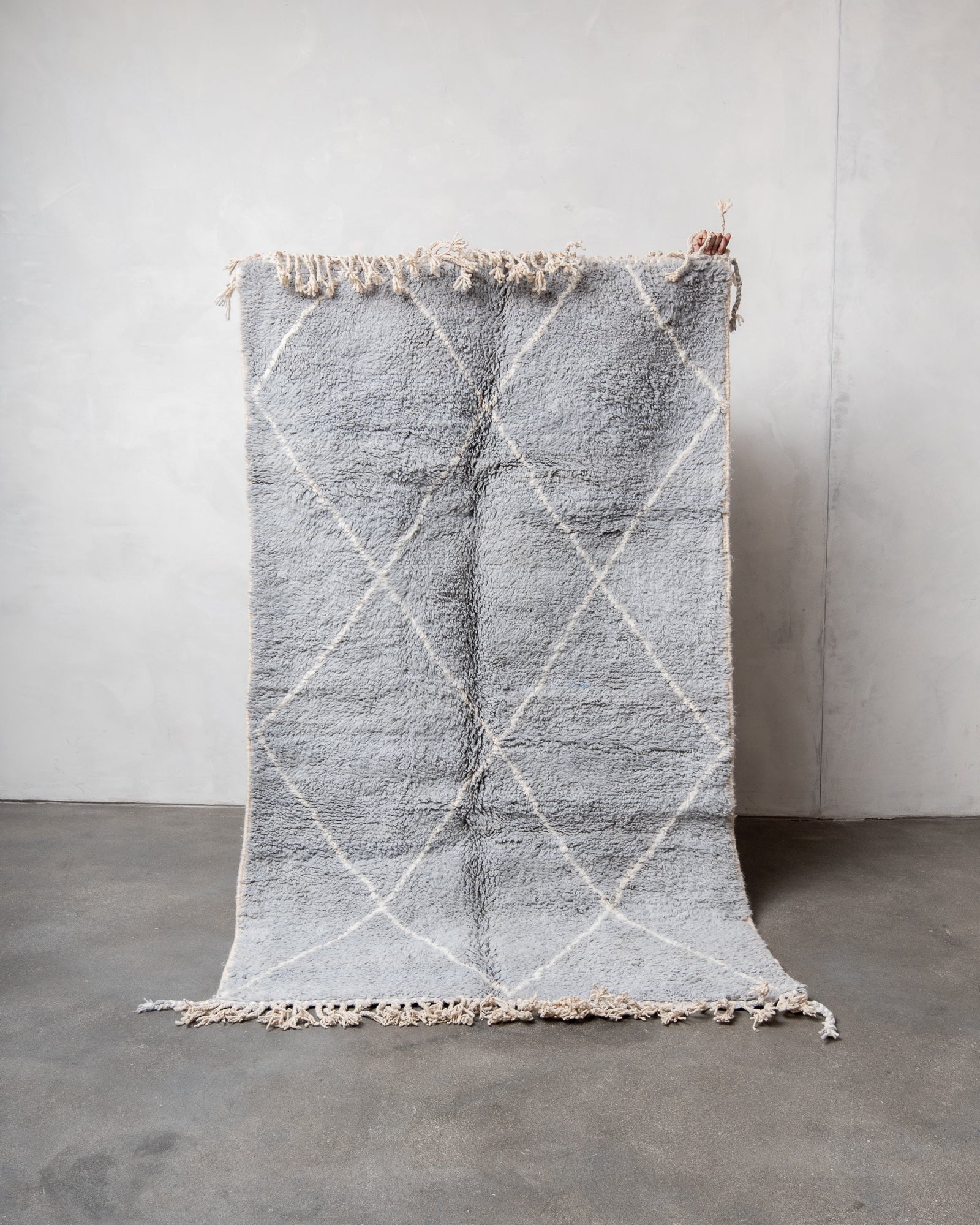 Modern, designer, handcrafted Berber rug from Morocco. Beniourain carpet with beautiful colours and patterns and fluffy wool texture.